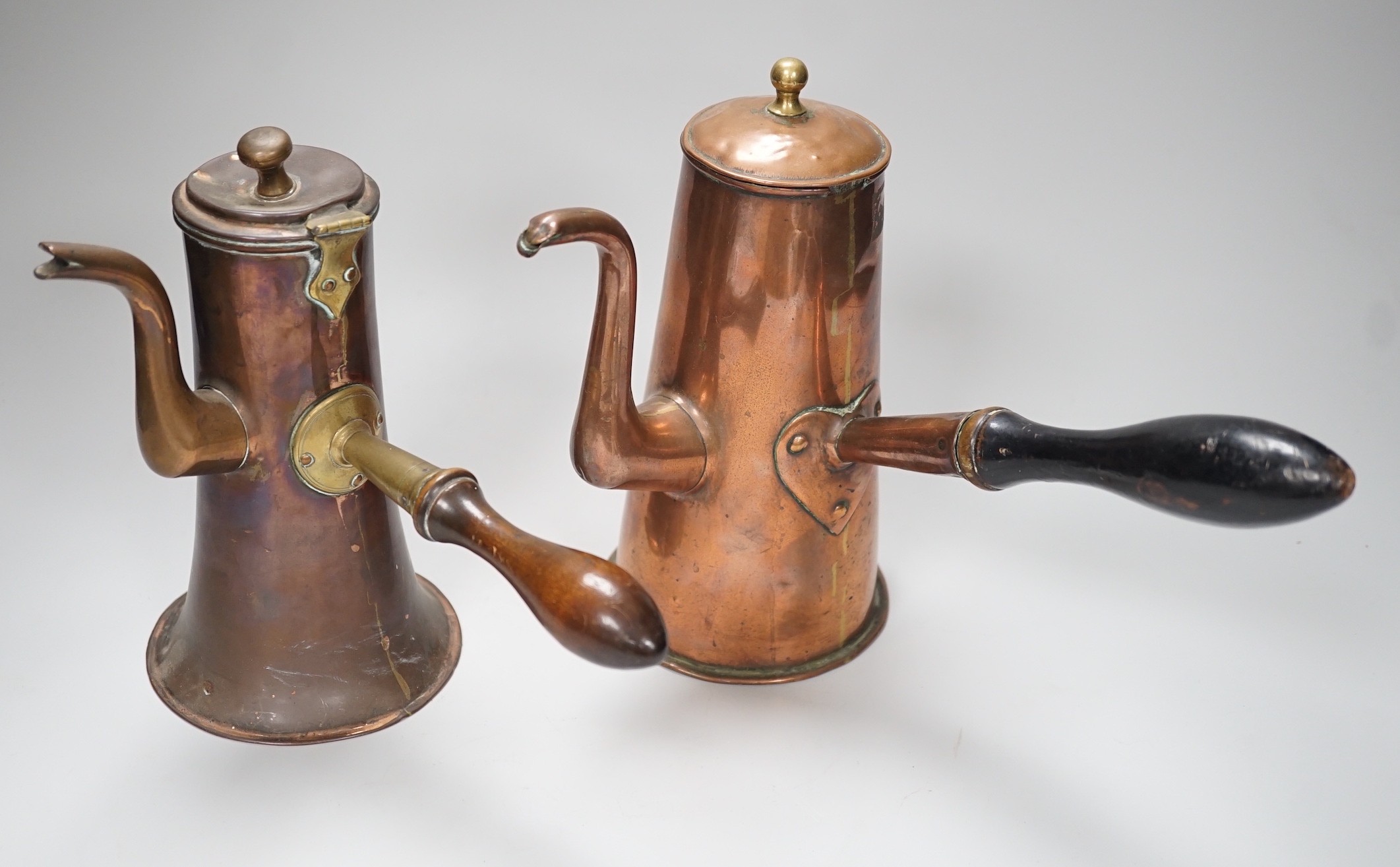 Two 18th century copper tavern coffee pots. Tallest 22.5cm